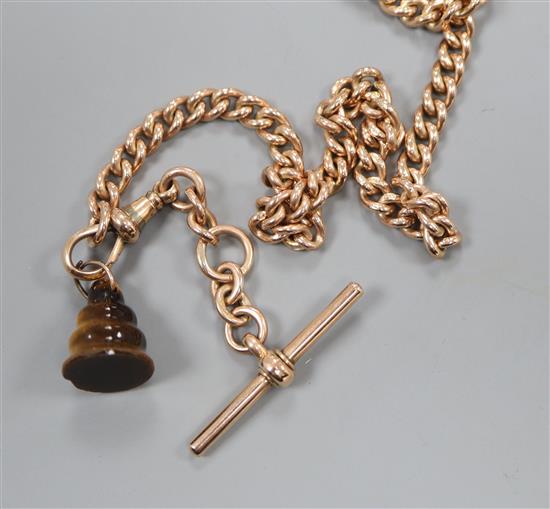 An early 20th century 9ct curblink albert, with tigers eye quartz charm,